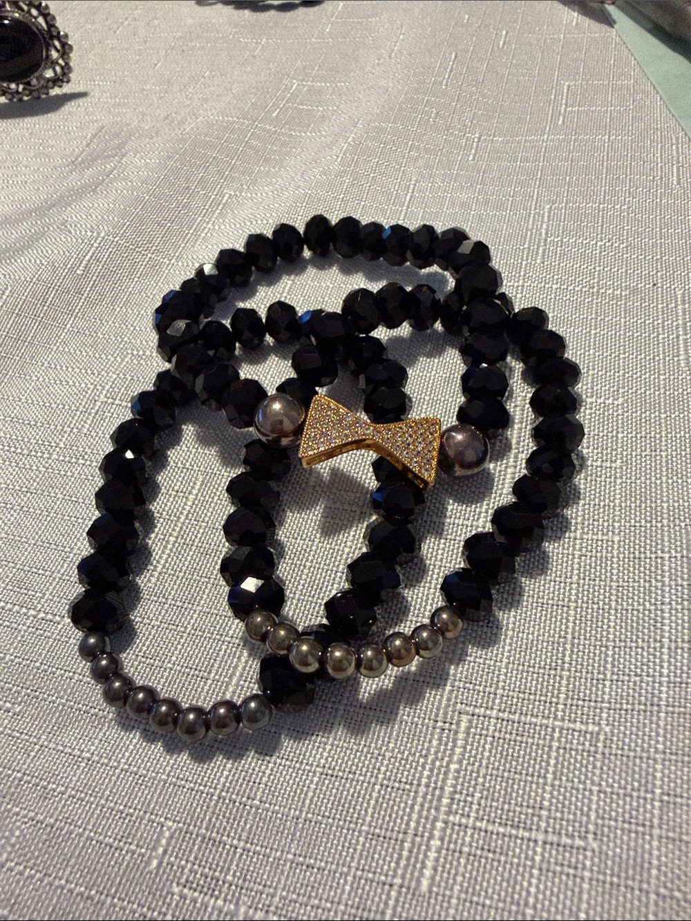 Claire's Black Beaded Bracelet with Gold Bow Accent